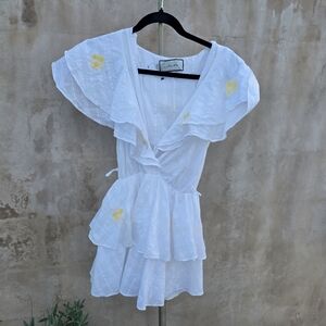 Innika choo white ruffled mini dress with flower